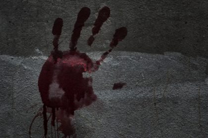 Blood of hand on a wall in an abandoned house them.The story about the murder